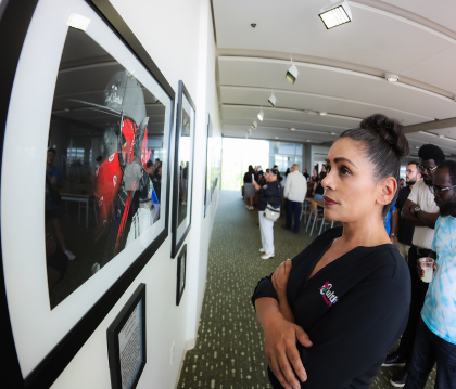 Woman looking at photograph of farmer