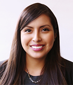 graduate alumna with brown hair and black top