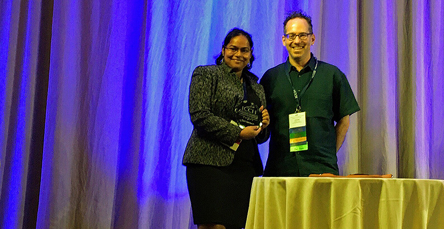 Dr. Deepti Chittamuru (left) receiving best abstract award at ICCH 2019.